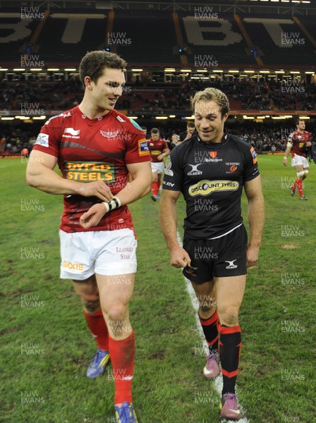 300313 - Newport-Gwent Dragons v Scarlets - RaboDirect PRO12 - George North of Scarlets and Will Harries of Newport-Gwent Dragons at the end of the game 