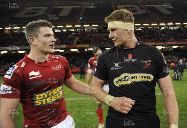 300313 - Newport-Gwent Dragons v Scarlets - RaboDirect PRO12 - Scott Williams of Scarlets and Andrew Coombs of Newport-Gwent Dragons at the end of the game 