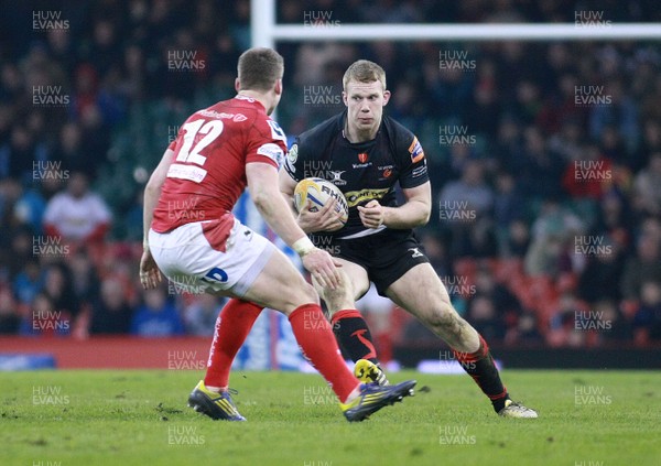 300313 Newport Gwent Dragons v Scarlets - RaboDirectPro12 -Dragons' Jack Dixon takes on Scarlets' Scott Williams