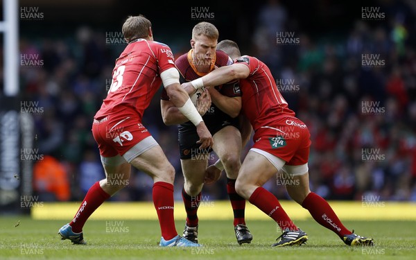 300416 - Newport Gwent Dragons v Scarlets - Judgement Day - Guinness PRO12 - Jack Dixon of Newport Gwent Dragons is tackled by Hadleigh Parkes and Scott Williams of Scarlets