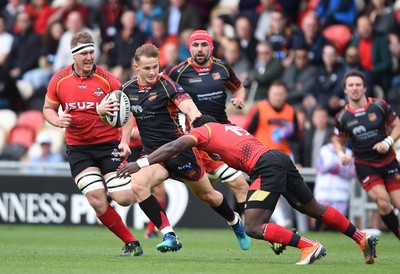 080918 - Dragons v Southern Kings - Guinness PRO14 - Hallam Amos of Dragons is tackled by Yaw Penxe of Southern Kings