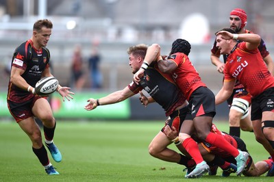 080918 - Dragons v Southern Kings - Guinness PRO14 - Tyler Morgan of Dragons gets the ball away to Hallam Amos