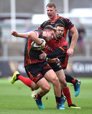 080918 - Dragons v Southern Kings - Guinness PRO14 - Tyler Morgan of Dragons is tackled by Bjorn Basson of Southern Kings