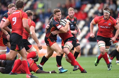 080918 - Dragons v Southern Kings - Guinness PRO14 - Hallam Amos of Dragons is tackled by Stephan De Wit of Southern Kings