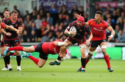 080918 - Dragons v Isuzu Southern Kings, Guinness PRO14 - Cory Hill of Dragons looks for support as he is tackled