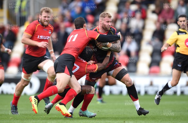 080918 - Dragons v Southern Kings - Guinness PRO14 - Ross Moriarty of Dragons is tackled by Bjorn Basson and Masixole Banda of Southern Kings