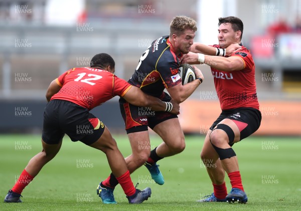 080918 - Dragons v Southern Kings - Guinness PRO14 - Tyler Morgan of Dragons is tackled by Berton Klassen and Michael Willemse of Southern Kings