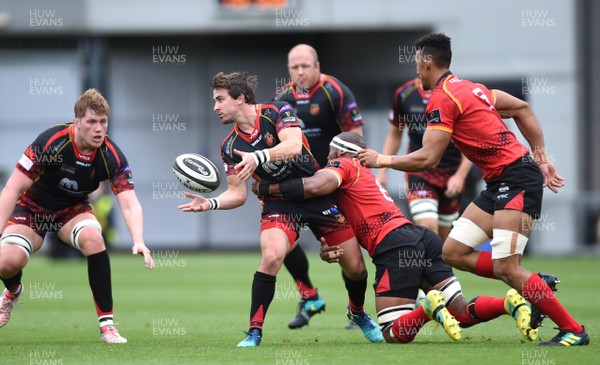 080918 - Dragons v Southern Kings - Guinness PRO14 - Rhodri Williams of Dragons is tackled by Andisa Ntsila of Southern Kings