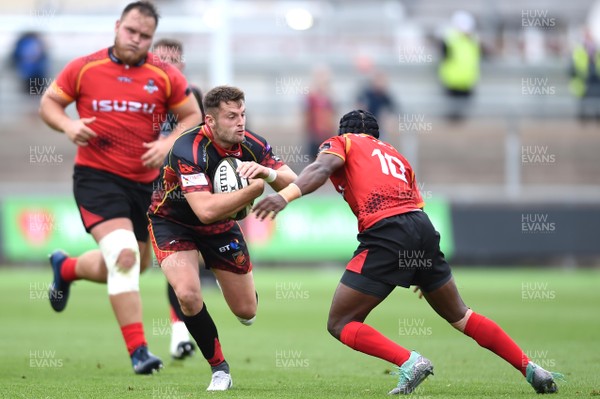 080918 - Dragons v Southern Kings - Guinness PRO14 - Josh Lewis of Dragons takes on Masixole Banda of Southern Kings