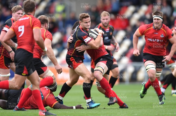 080918 - Dragons v Southern Kings - Guinness PRO14 - Hallam Amos of Dragons is tackled by Stephan De Wit of Southern Kings