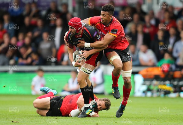 080918 - Dragons v Isuzu Southern Kings, Guinness PRO14 - Cory Hill of Dragons looks for support as he is tackled