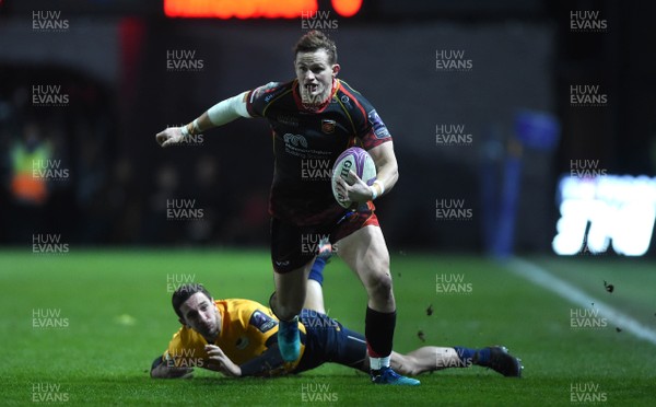 110119 - Dragons v Timisoara Saracens - European Rugby Challenge Cup - Hallam Amos of Dragons is tackled by Stephen Shennan of Timisoara Saracens