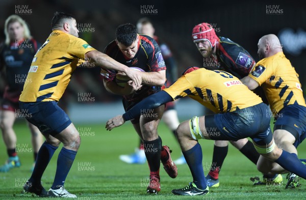 110119 - Dragons v Timisoara Saracens - European Rugby Challenge Cup - Chris Coleman of Dragons is tackled by Eugen Capatina and Marius Iftimiciuc of Timisoara Saracens