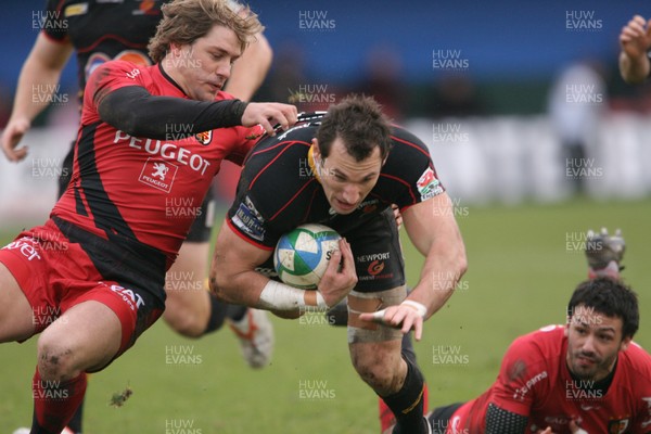 13.12.08 Dragons v Toulouse... Dragons' Joe Bearman is tackled by Toulouse's Cedric Heymans leaving Clement Poitreneaud grounded. 