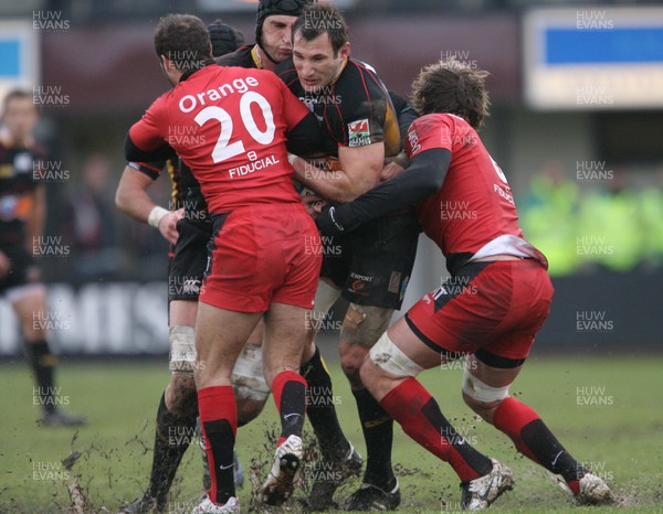 13.12.08 Dragons v Toulouse... Dragons Joe Bearman is tackled by Toulouse's Frederic Michalak and  Shaun Sowerby. 