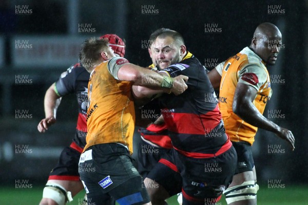 230318 - Dragons v Toyota Cheetahs - Guinness PRO14 -  Gerard Ellis of Dragons is tackled by Paul Schoeman of Cheetahs