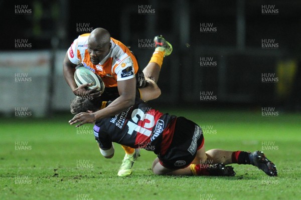 230318 - Dragons v Toyota Cheetahs - Guinness PRO14 - Oupa Mohoje of Toyota Cheetahs is tackled by Sam Beard of Dragons