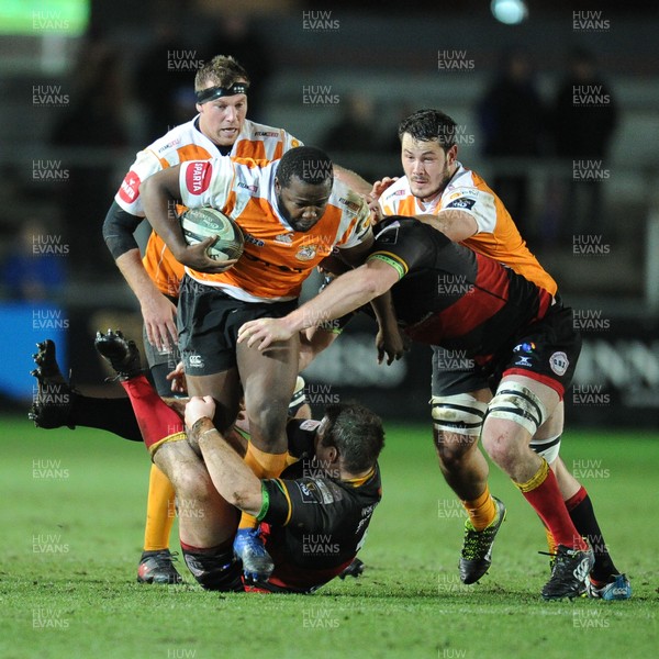 230318 - Dragons v Toyota Cheetahs - Guinness PRO14 - Ox Nche of Toyota Cheetahs is tackled by Sam Hobbs of Dragons and Joe Davies of Dragons