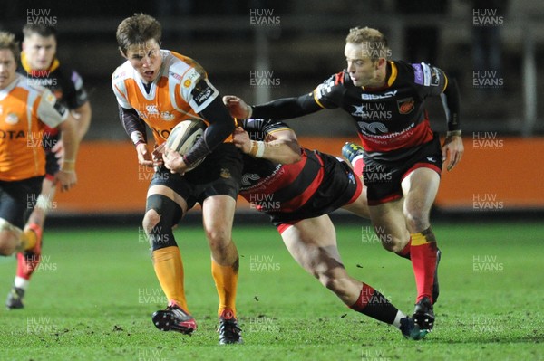 230318 - Dragons v Toyota Cheetahs - Guinness PRO14 - William Small-Smith of Toyota Cheetahs is tackled by Hallam Amos of Dragons