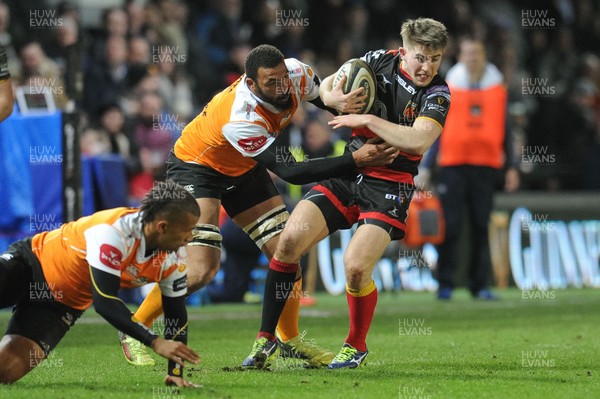 230318 - Dragons v Toyota Cheetahs - Guinness PRO14 - Arwel Robson of Dragons is tackled by Uzair Cassiem of Toyota Cheetahs