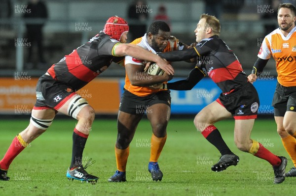 230318 - Dragons v Toyota Cheetahs - Guinness PRO14 - Ox Nche of Toyota Cheetahs is tackled by Joe Davies of Dragons and Sarel Pretorius of Dragons  