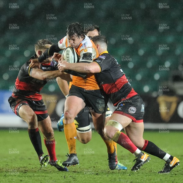230318 - Dragons v Toyota Cheetahs - Guinness PRO14 - Francois Venter of Toyota Cheetahs is tackled by  Connor Edwards of Dragons