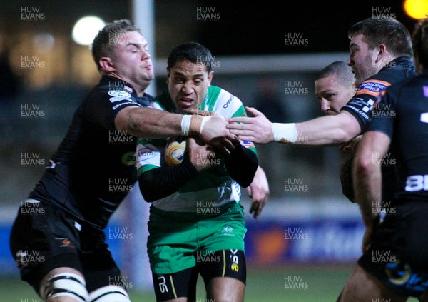 080213 Newport Gwent Dragons v Treviso - RaboDirectPro12 -Treviso's Brendan Williams punches a hole between Dragons' Lewis Jones and Hugh Gustafason 