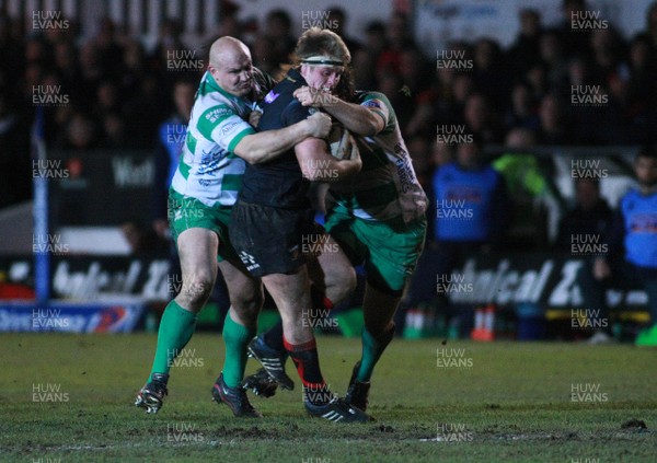 080213 Newport Gwent Dragons v Treviso - RaboDirectPro12 -Dragons' Nick Cudd is tackled by Treviso's Bees Roux and Ignacio Fernandez-Rouyet 