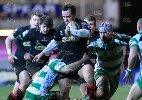 080213 Newport Gwent Dragons v Treviso - RaboDirectPro12 -Dragons' Dan Evans is tackled by Treviso's Luca Morisi 