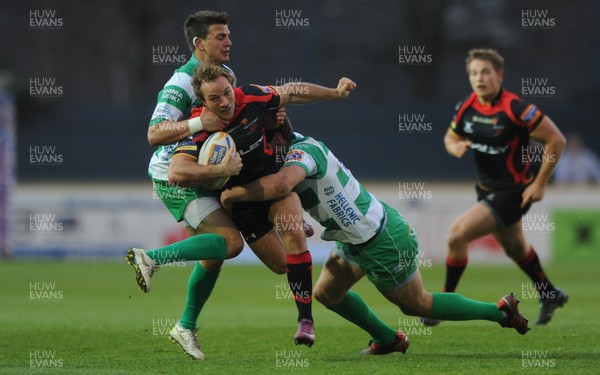 130412 - Newport-Gwent Dragons v Benetton Treviso - RaboDirect PRO12 -Will Harries of Newport-Gwent Dragons is tackled by Tommaso Iannone and Alberto Sgarbi of Benetton Treviso