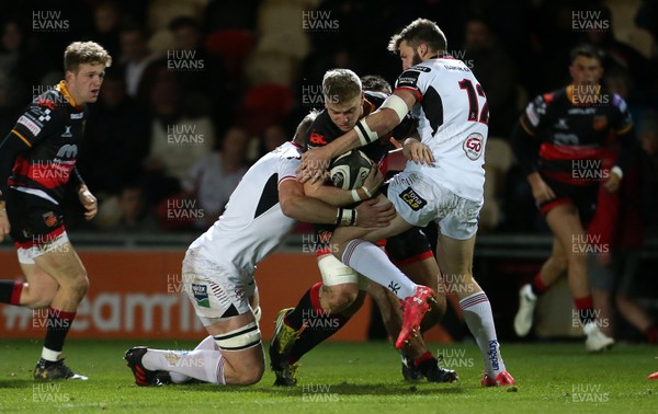 011217 - Dragons v Ulster - Guinness PRO14 - Aaron Wainwright of Dragons is tackled by Stuart Reidy and Stuart McCloskey of Ulster