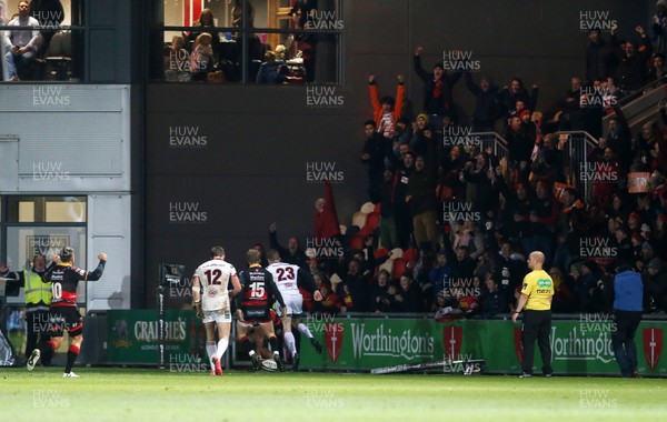 011217 - Dragons v Ulster - Guinness PRO14 - The crowd and players celebrate as Ashton Hewitt of Dragons scores a try