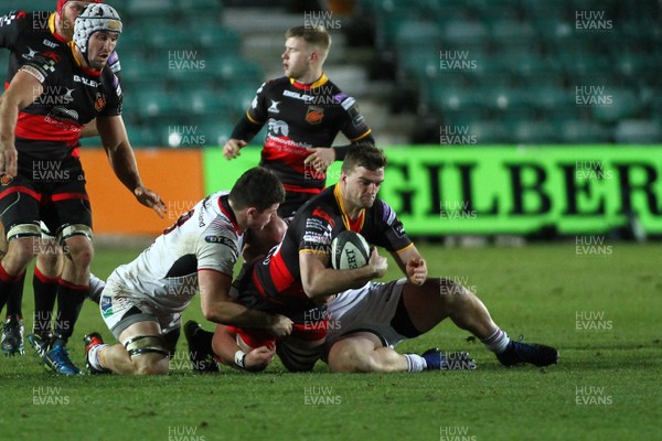 011217 - Dragons v Ulster - GuinnessPro14 -  Ben Roach of Dragons is tackled by Nick Timoney and Andrew Warwick of Ulster