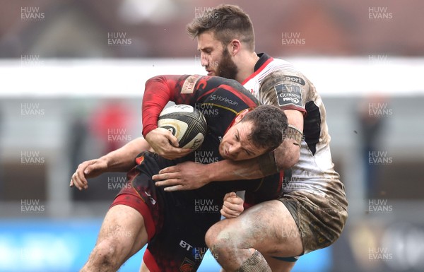 030319 - Dragons v Ulster - Guinness PRO14 - Adam Warren of Dragons is tackled by Stuart McCloskey of Ulster
