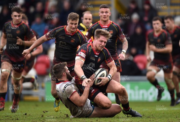030319 - Dragons v Ulster - Guinness PRO14 - Tyler Morgan of Dragons is tackled by Stuart McCloskey of Ulster