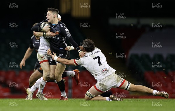 130321 - Dragons v Ulster - Guinness PRO14 - Sam Davies of Dragons is tackled by Michael Lowry and Sean Reidy of Ulster