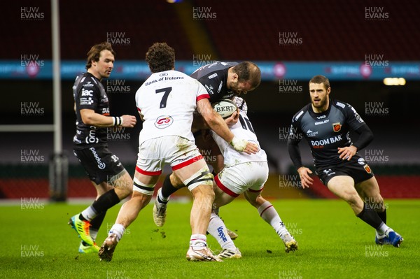 130321 - Dragons v Ulster - Guinness PRO14 - Jamie Roberts of Dragons is tackled by Michael Lowry of Ulster and Sean Reidy of Ulster
