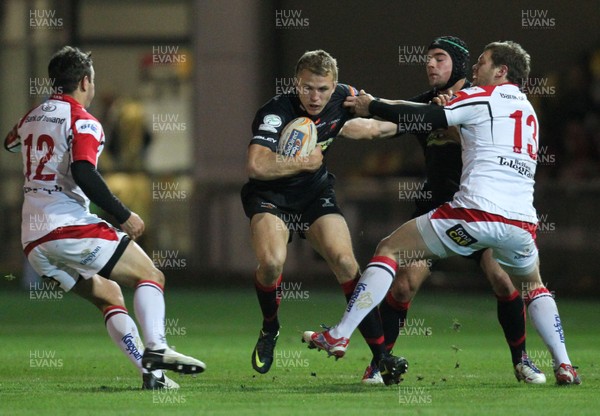 261012 - Newport Gwent Dragons v Ulster, RaboDirect PRO12 - Tom Prydie of Newport-Gwent Dragons is held by Darren Cave of Ulster