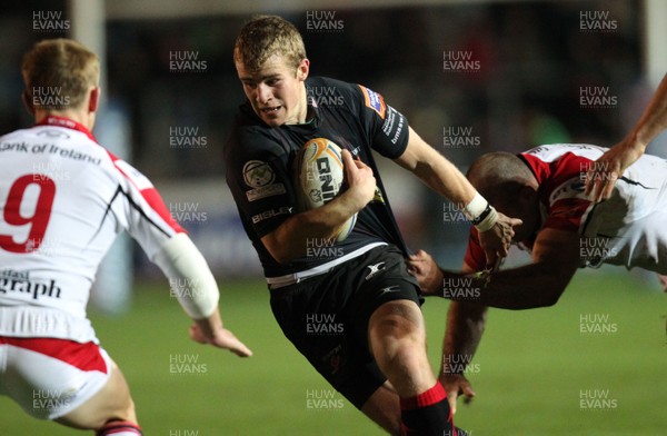 261012 - Newport Gwent Dragons v Ulster, RaboDirect PRO12 - Jonathan Evans of Newport-Gwent Dragons is tackled by Lewis Stevenson of Ulster