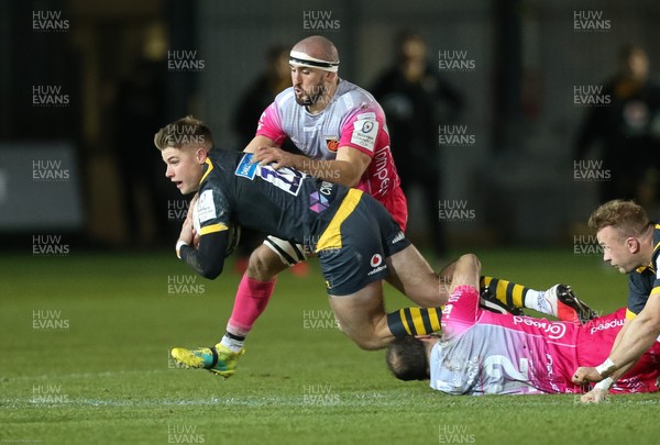121220 - Dragons v Wasps, Heineken European Champions Cup - Charlie Atkinson of Wasps is tackled by Jamie Roberts of Dragons and Ollie Griffiths of Dragons
