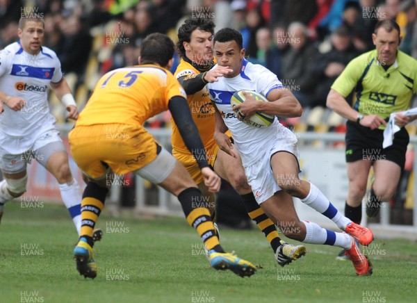 161113 - Newport Gwent Dragons v London Wasps - LV Cup -Ashton Hewitt of Newport Gwent Dragons is tackled by Ben Jacobs of London Wasps and looks to run past Tommy Bell of London Wasps(c)Huw Evans Picture Agency