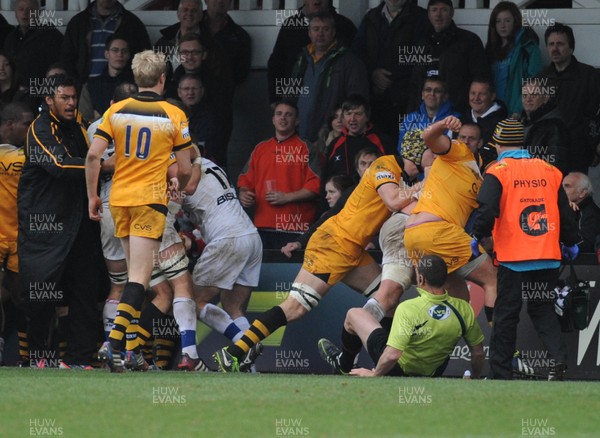 161113 - Newport Gwent Dragons v London Wasps - LV Cup -Touch judge Neil Hennessy is pushed over after attempting to intervene in the fights that broke out on the pitch at Rodney Parade after the intensity of the game increased