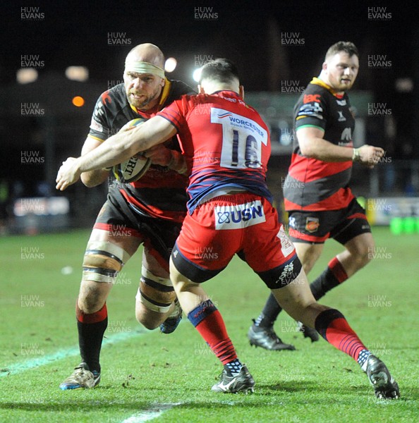 020218 - Dragons v Worcester - Anglo Welsh Cup -  Rynard Landman is tackled by Matti Williams