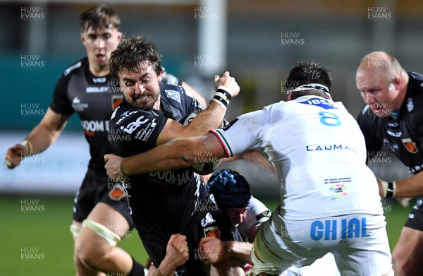 091020 - Dragons v Zebre - Guinness PRO14 - Rhodri Williams of Dragons is tackled by David Sisi of Zebre