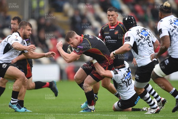 220918 - Dragons v Zebre - Guinness PRO14 - Jack Dixon of Dragons is tackled by Carlo Canna of Zebre