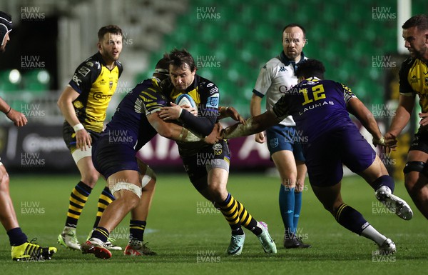 290324 - Dragons v Zebre - United Rugby Championship -  Rhodri Williams of Dragons is tackled by Giovanni Licata of Zebre 