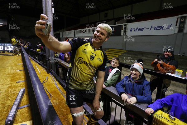 290324 - Dragons v Zebre - United Rugby Championship -  Aaron Wainwright of Dragons with fans at full time