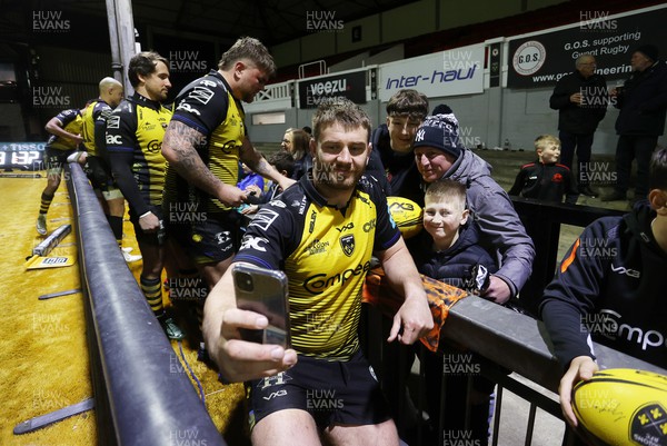 290324 - Dragons v Zebre - United Rugby Championship -  Rhodri Jones of Dragons with fans at full time