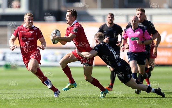 140919 - Dragons XV v Scarlets A - Celtic Cup - Morgan Williams of Scarlets is tackled by Carwyn Penny of Dragons