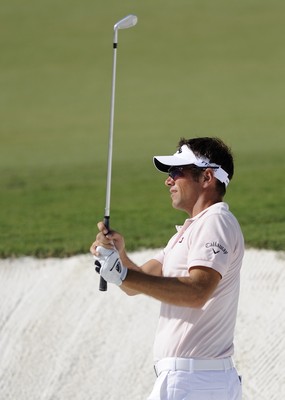 21.11.09 - Dubai World Championships 2009... Nick Dougherty of England plays his second shot out of the bunker on the par 5 14th. 